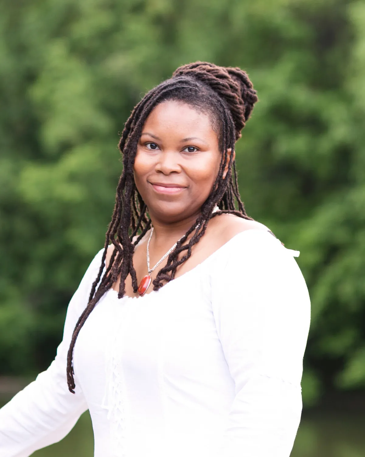 Nicole Jenkins, Licensed Clinical Psychotherapist, photographed outdoors beside water