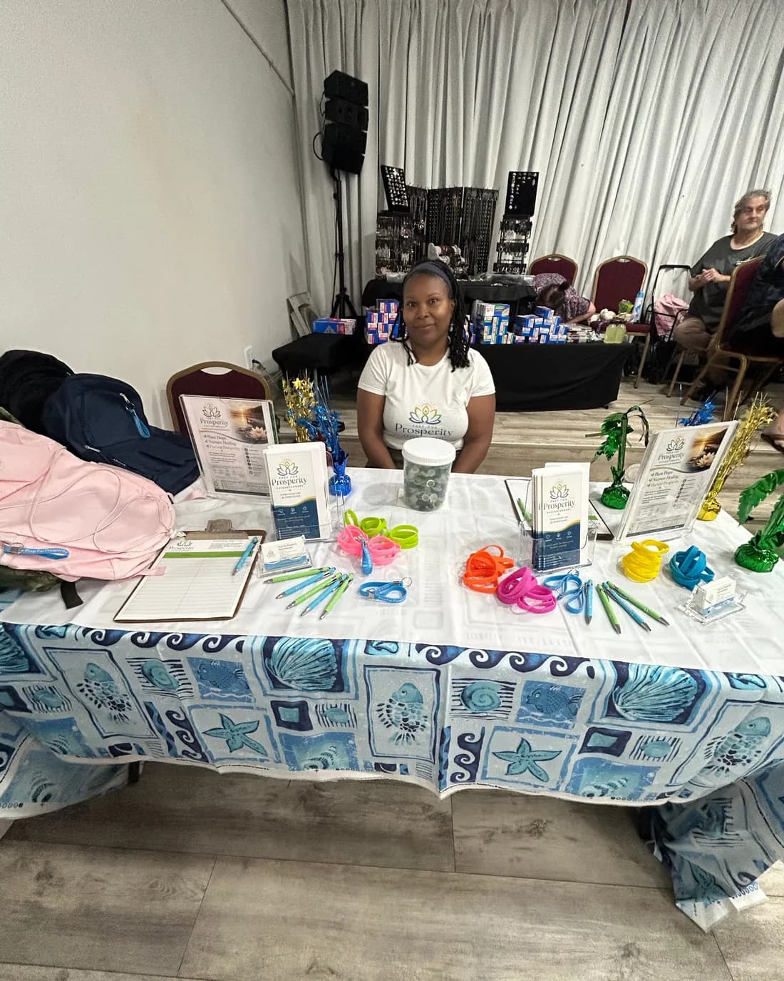 The Prep For Prosperity table set out with school backpacks and giveaways